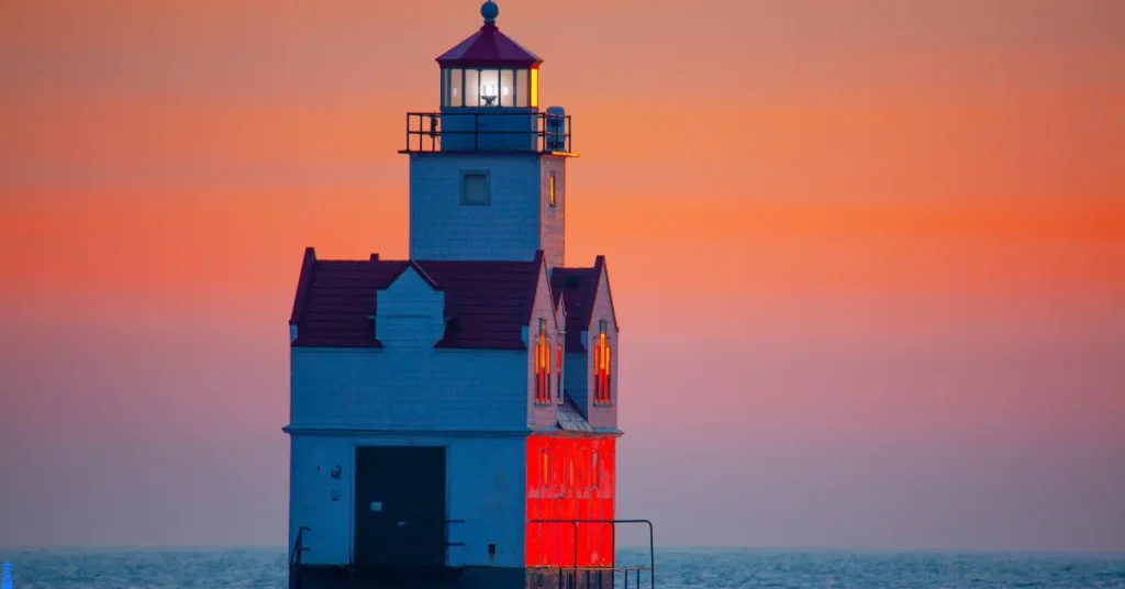 Lake Michigan Lighthouse covered in sunset's glow.