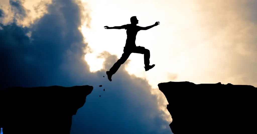 Person jumping a chasm.