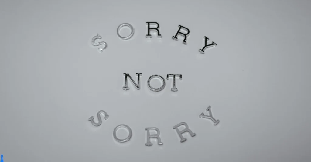 Sorry not sorry in black on white background.